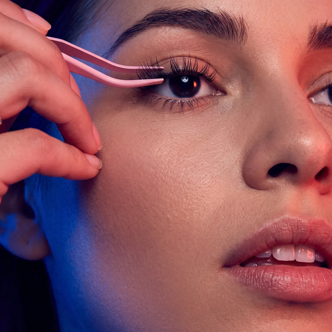 Applying lash clusters with precision tweezers